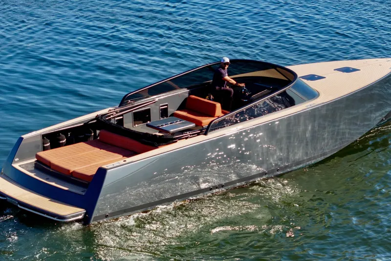 Slide: The Image of 2015 VanDutch 40 yacht cruising on clear blue water. - 11