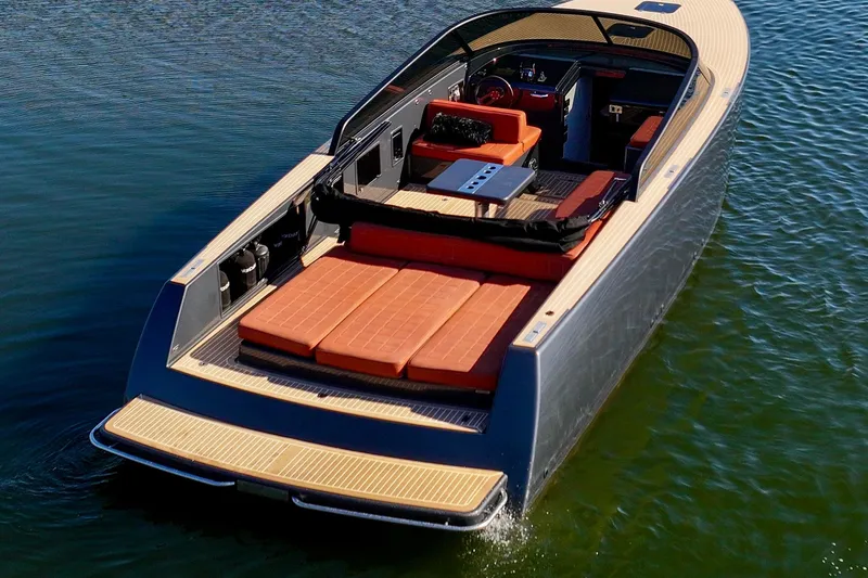 Slide: The Image of 2015 VanDutch 40 luxury yacht with sleek design on calm water. - 13