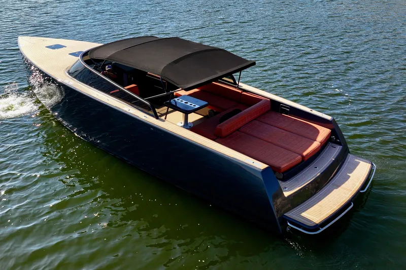 Slide: The Image of 2015 VanDutch 40 luxury yacht cruising on calm waters. - 16