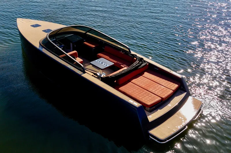 Slide: The Image of Luxurious 2015 VanDutch 40 yacht on sparkling water, featuring sleek design and spacious deck. - 18