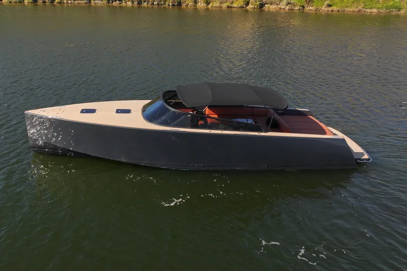 Slide: The Image of 2015 VanDutch 40 yacht with sleek design, cruising on calm water. - 2