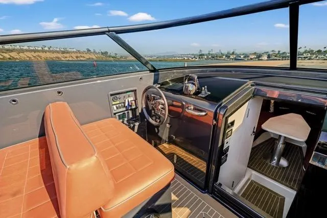 Slide: The Image of 2015 VanDutch 40 yacht interior with leather seating and modern helm. - 25