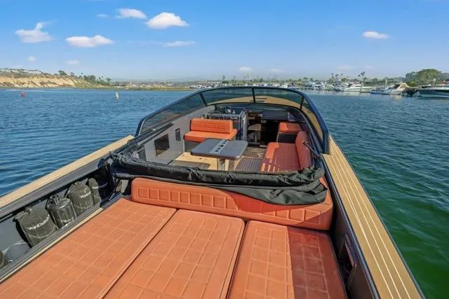 Slide: The Image of Luxurious 2015 VanDutch 40 yacht with spacious deck and elegant seating on calm waters. - 29