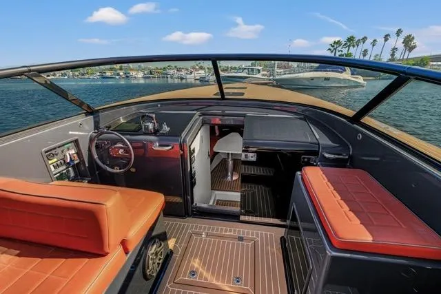 Slide: The Image of Interior of 2015 VanDutch 40 yacht with luxurious seating and modern dashboard. - 31