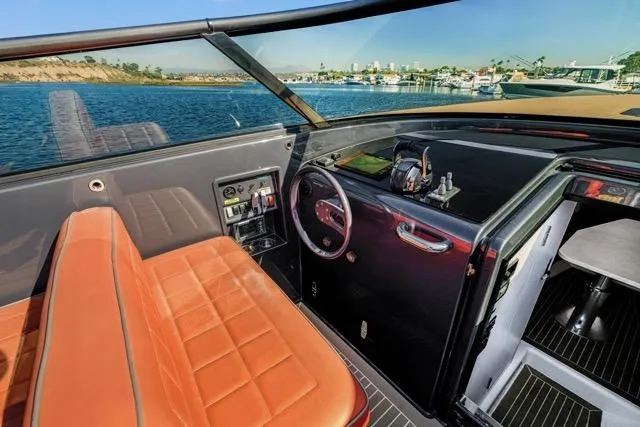 Slide: The Image of Interior of a 2015 VanDutch 40 yacht with leather seating and modern dashboard. - 32