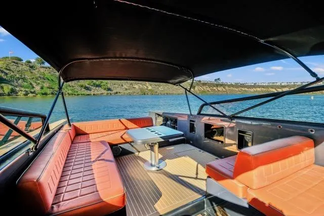 Slide: The Image of Luxurious 2015 VanDutch 40 yacht interior with orange seating and scenic water view. - 36