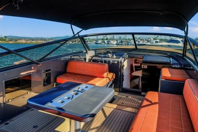 Slide: The Image of 2015 VanDutch 40 yacht interior with orange seating and sleek design on the water. - 38