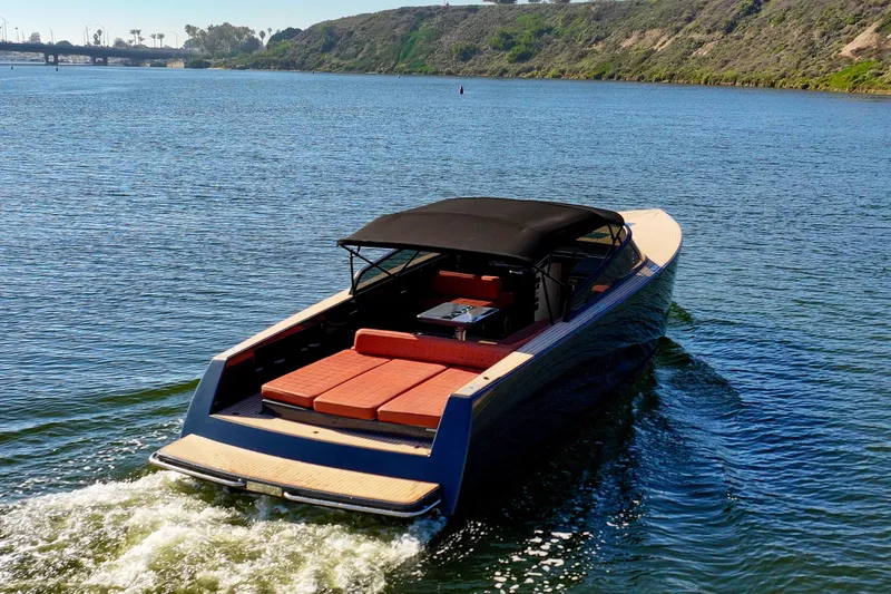 Slide: The Image of Luxurious 2015 VanDutch 40 yacht cruising on a scenic waterway. - 4
