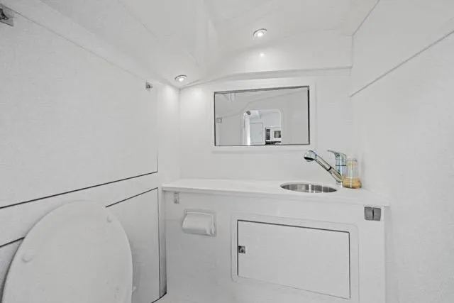 Slide: The Image of Interior of 2015 VanDutch 40 yacht bathroom with modern white design. - 52