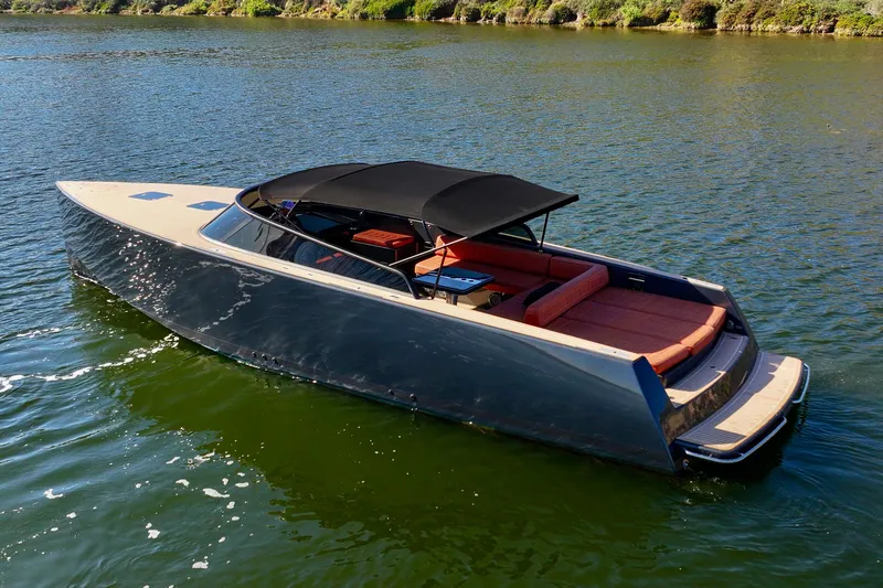 Slide: The Image of 2015 VanDutch 40 luxury yacht on calm water, featuring sleek design and spacious seating. - 7