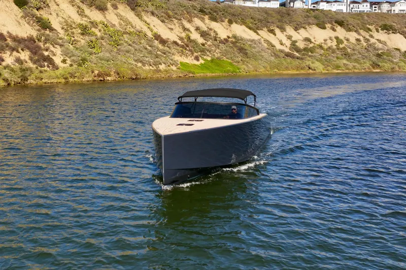 Slide: The Image of 2015 VanDutch 40 yacht cruising on a scenic waterway. - 8