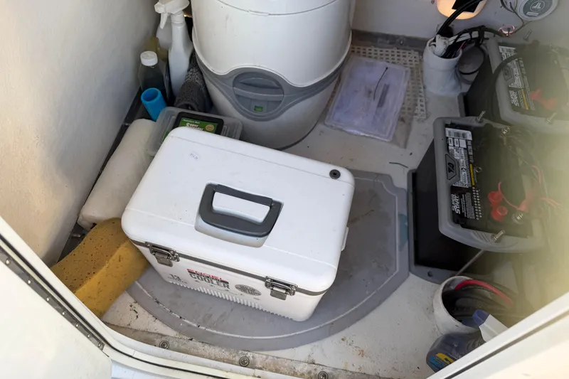 Slide: The Image of 2018 Twin Vee 260 CC SE boat dashboard with steering wheel and controls. - 11