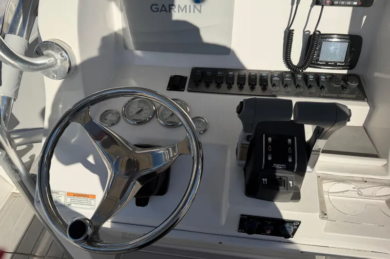 Slide: The Image of 2018 Twin Vee 260 CC SE boat on trailer in outdoor setting. - 12