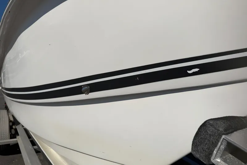 Slide: The Image of 2018 Twin Vee 260 CC SE boat hull with black stripe detail. - 18