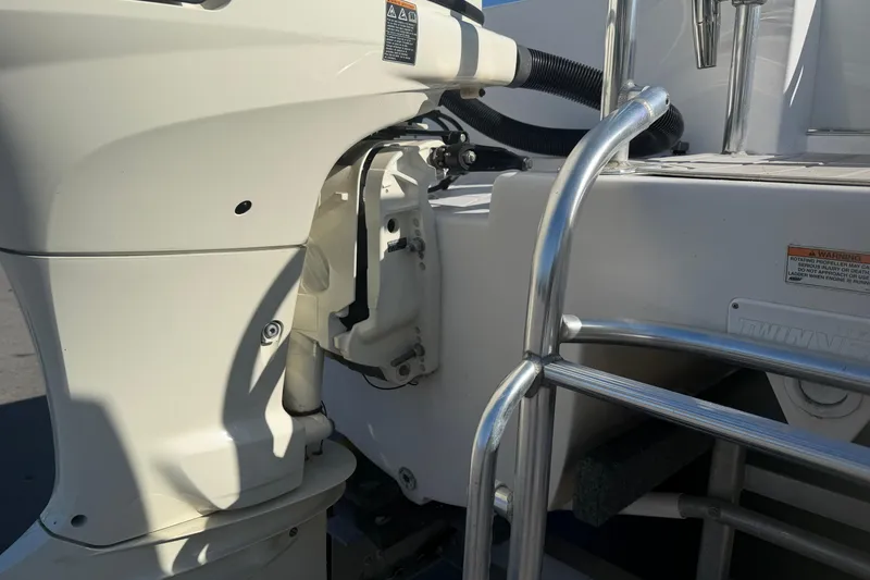 Slide: The Image of 2018 Twin Vee 260 CC SE boat engine and ladder detail. - 27