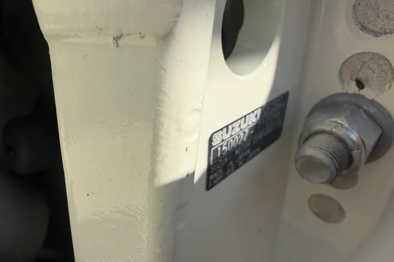 Slide: The Image of Close-up of a 2018 Twin Vee 260 CC SE boat's Suzuki engine serial plate. - 28