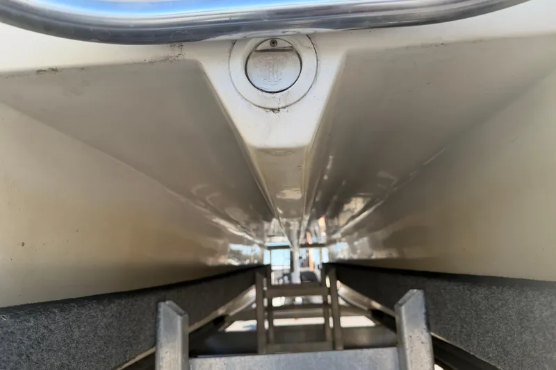 Slide: The Image of 2018 Twin Vee 260 CC SE boat hull on trailer, close-up view. - 29