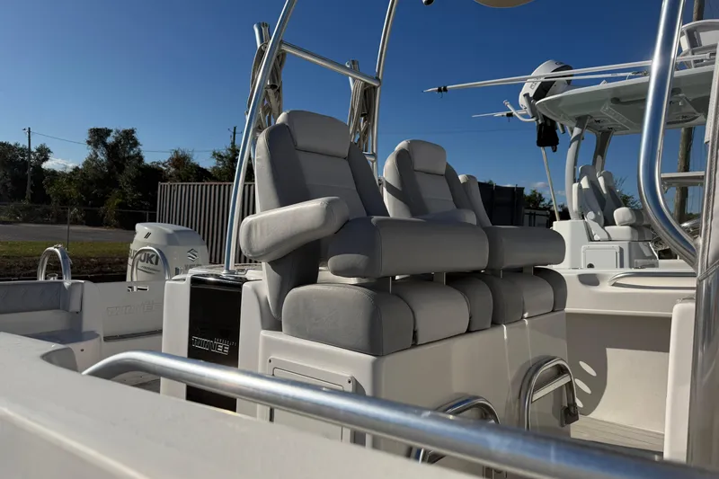 Slide: The Image of 2018 Twin Vee 260 CC SE boat interior with comfortable seating and sleek design. - 3
