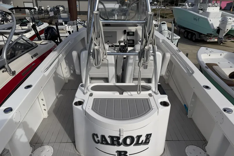 Slide: The Image of 2018 Twin Vee 260 CC SE boat interior with helm and seating area. - 33