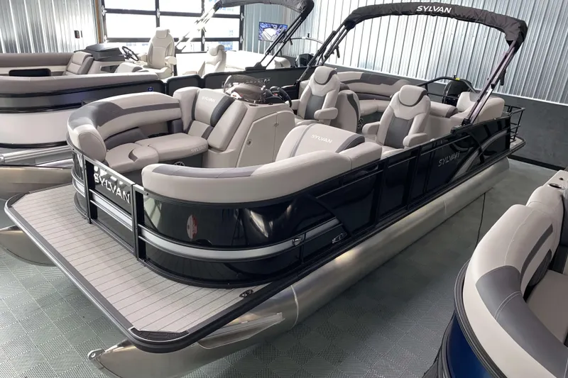 The Image of 2025 Sylvan L3 LZ pontoon boat with luxurious seating in a showroom. - 0