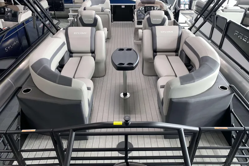 Slide: The Image of Luxurious 2025 Sylvan L3 LZ pontoon boat interior with plush seating and modern design. - 12