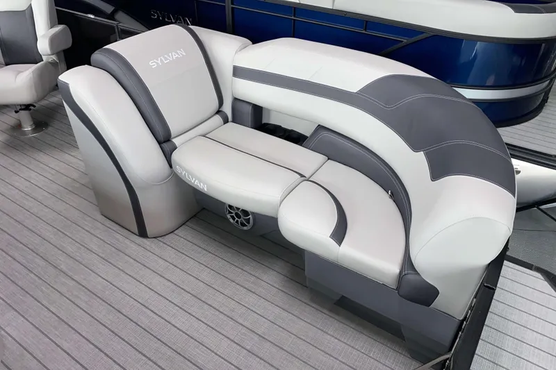 Slide: The Image of 2025 Sylvan L3 LZ boat seating with gray and white upholstery on deck. - 2