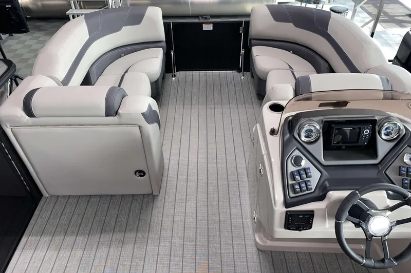 Slide: The Image of Luxurious interior of 2025 Sylvan L3 LZ pontoon boat with plush seating and modern dashboard. - 4