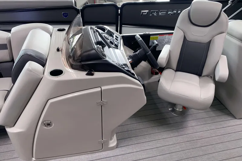 Slide: The Image of 2025 Sylvan L3 LZ boat interior with modern helm and comfortable seating. - 6
