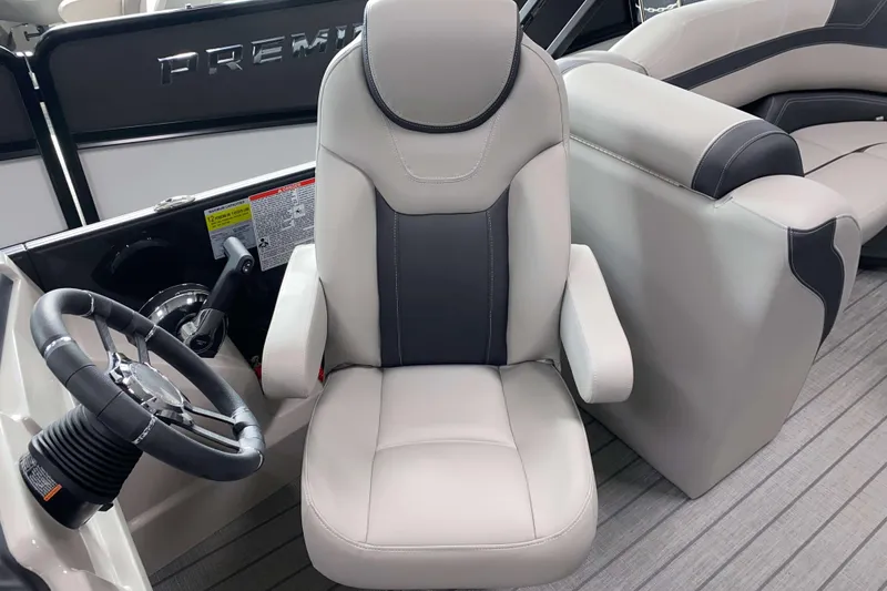Slide: The Image of Captain's chair and steering wheel of 2025 Sylvan L3 LZ boat interior. - 8