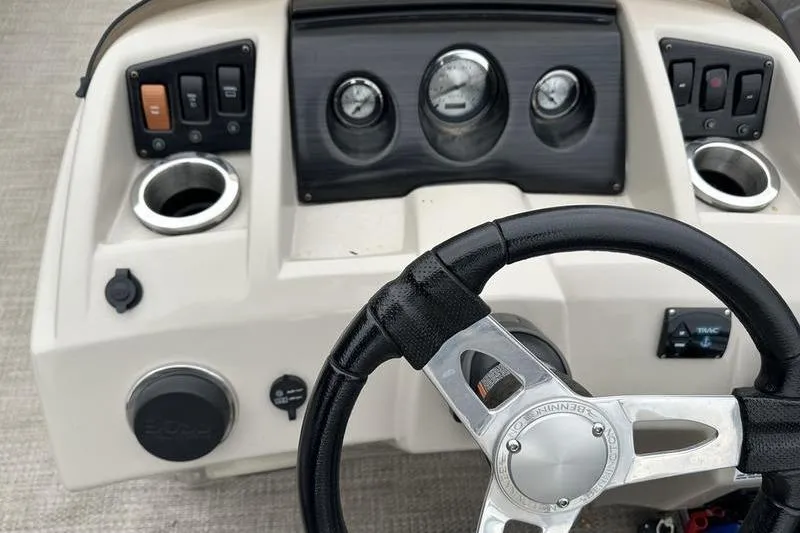 Slide: The Image of Steering console of a 2018 Bennington 21SLX boat with gauges and controls. - 19