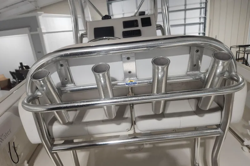 Slide: The Image of Dashboard of a 2012 Edgewater 228CC boat with navigation and audio controls. - 10