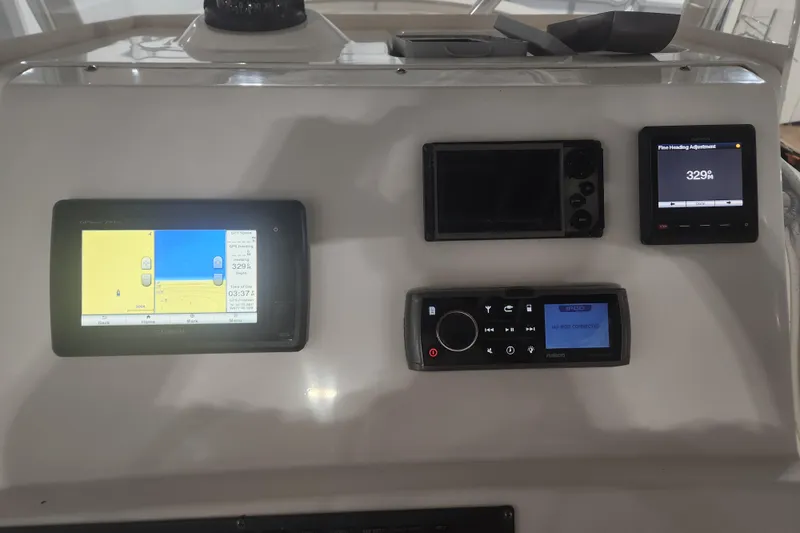 Slide: The Image of Dashboard display of a 2012 Edgewater 228CC showing trip and fuel data. - 11