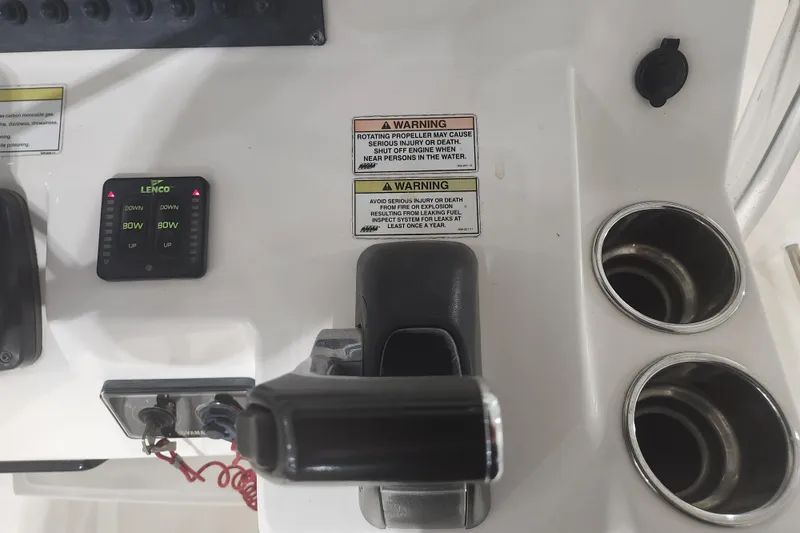 Slide: The Image of 2012 Edgewater 228CC boat storage compartment under T-top. - 13