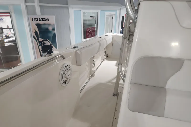 Slide: The Image of Interior view of 2012 Edgewater 228CC boat with cushioned seating. - 18