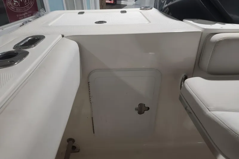 Slide: The Image of 2012 Edgewater 228CC boat wiring and pump system in compartment. - 26