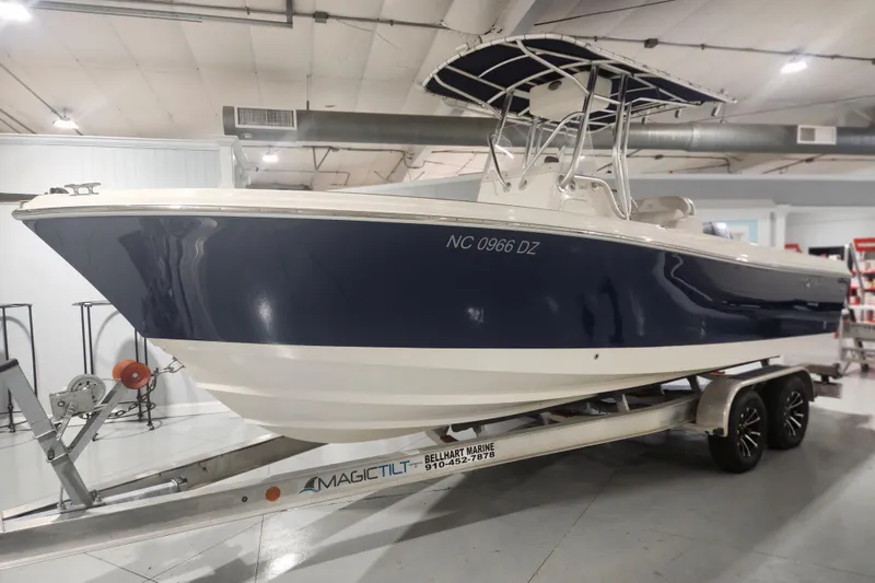 Slide: The Image of 2012 Edgewater 228CC boat with Yamaha outboard motor in showroom. - 4