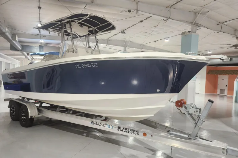 Slide: The Image of Edgewater 228CC 2012 boat logo and model number on white surface. - 6