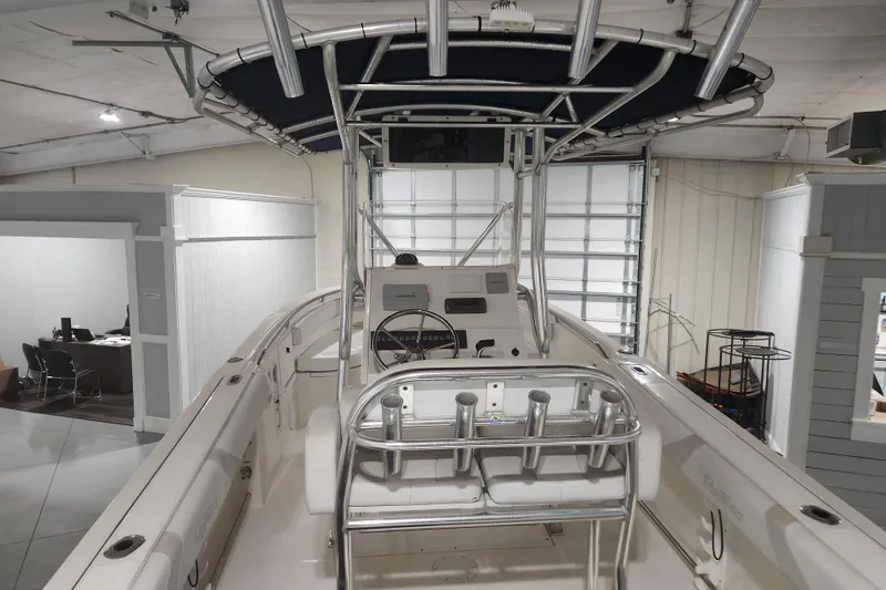 Slide: The Image of 2012 Edgewater 228CC boat with stainless steel rod holders and seating. - 9