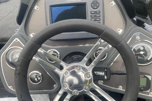Slide: The Image of Steering wheel and dashboard of 2013 Ranger Z118 boat with gauges and electronics. - 3