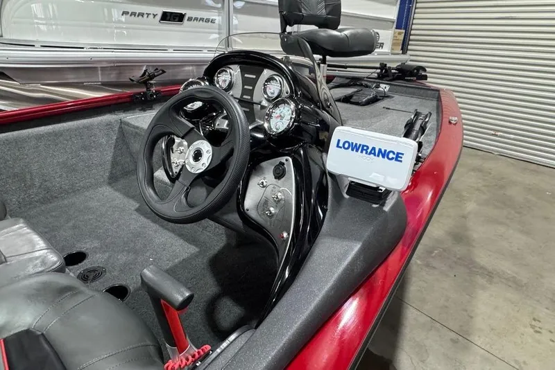 Slide: The Image of 2021 Tracker Pro Team 175 TXW boat interior with steering wheel and Lowrance device. - 11