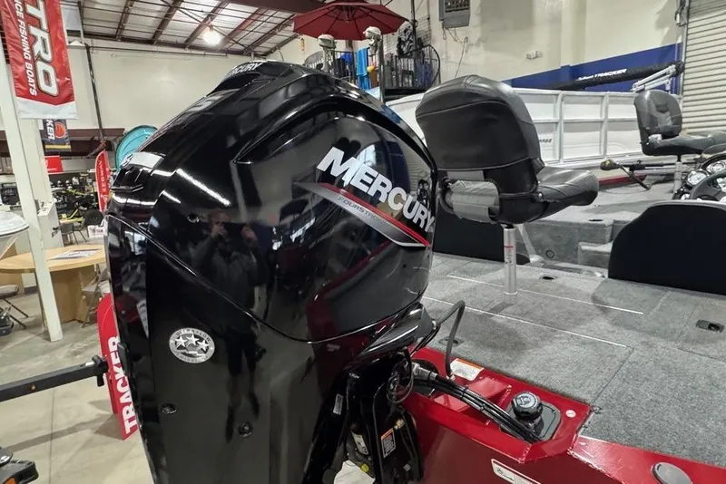 Slide: The Image of 2021 Tracker Pro Team 175 TXW boat with Mercury engine in showroom. - 13
