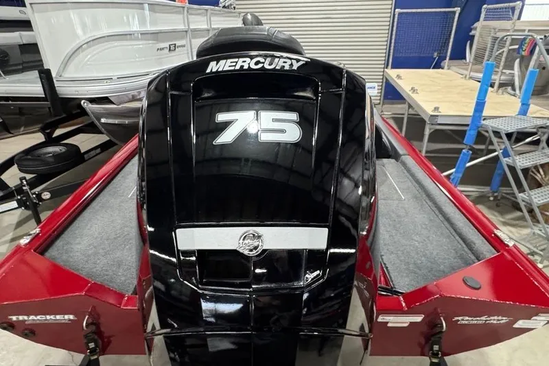 Slide: The Image of 2021 Tracker Pro Team 175 TXW with Mercury 75 engine in a showroom. - 16
