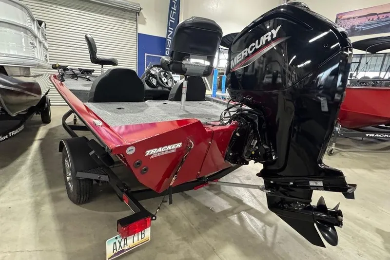 Slide: The Image of 2021 Tracker Pro Team 175 TXW boat with Mercury engine in showroom. - 23