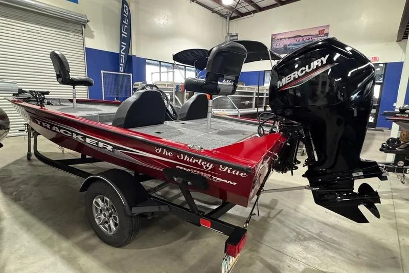 Slide: The Image of 2021 Tracker Pro Team 175 TXW boat with Mercury engine in showroom. - 24