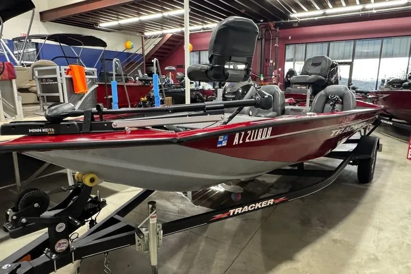 Slide: The Image of 2021 Tracker Pro Team 175 TXW boat displayed indoors on a trailer. - 29
