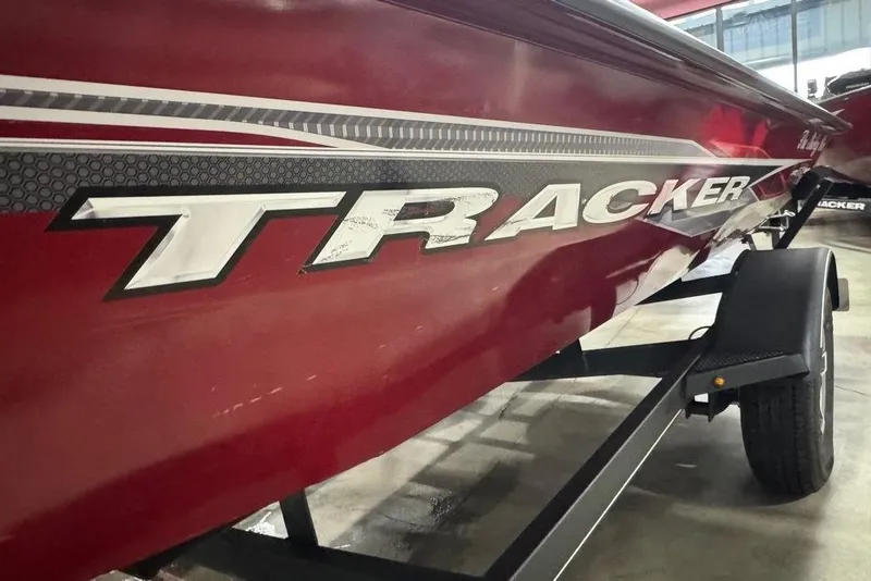Slide: The Image of Red 2021 Tracker Pro Team 175 TXW boat on trailer, showcasing bold branding. - 30