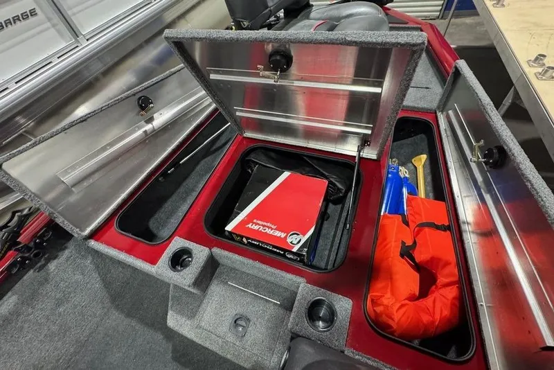 Slide: The Image of 2021 Tracker Pro Team 175 TXW boat storage compartments with safety gear and equipment. - 34