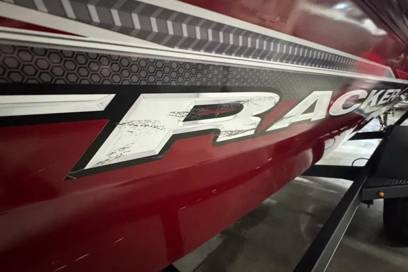 Slide: The Image of Red 2021 Tracker Pro Team 175 TXW boat with bold graphics and hexagonal pattern. - 35