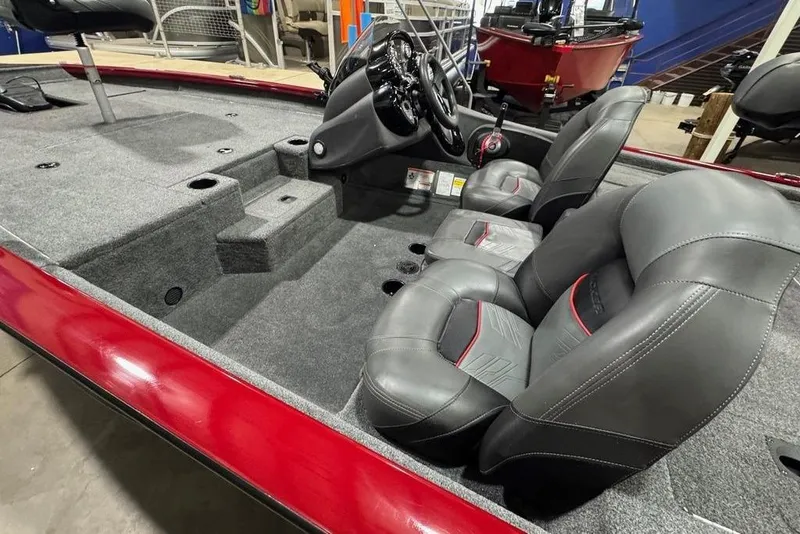 Slide: The Image of 2021 Tracker Pro Team 175 TXW boat interior with gray seats and red accents. - 36