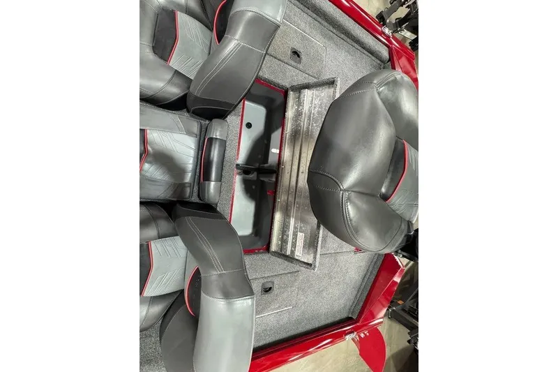Slide: The Image of 2021 Tracker Pro Team 175 TXW boat interior with gray and red seating. - 38